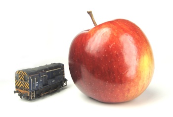 A picture of a weathered Class 08, next to a tasty apple.