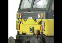 A picture of 47706 showing a partial respray to Scotrail blue stripe with NSE branding in a very dilapidated state with special effects of fading and paint flaking. Other details include: detailed buffer beam at one end, body lowered, etched fan and grill, moulded nose handrails replaced with wire, renumbered, TDM cables with wire fitted on nose, modified battery box, finer ariels, driver and nose catch added