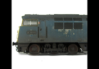 A picture of Close up showing the smaller holes on the wheels and the distressed flaking body work.