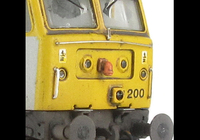 A picture of 47200 showing a full respray into Cotswold Rail livery. Base model has been converted to a cutaway buffer beam example with etched kick plates and modified battery box. Other details include: detailed buffer beam at one end, moulded nose handrails replaced with wire, renumbered, etched nameplates, moulded roof grills replaced with etched fan and grill, pipe added to nose, body lowered, finer ariels, snowploughs and nose catch added
