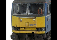 A picture of 60078 Faded Mainline livery, detailed buffer beam at one end, body lowered, EWS sticker added along with yellow snowploughs, driver and paint flaking on window surrounds.