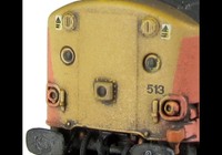 A picture of 37513 with full respray into Loadhaul livery including faded paint. Other details include bogie modification to reduce gap between body and bogies, battery box modification, finer aerial, speedo cable added, rectangular buffers at one end, driver, renumbered, detailed buffer beam at one end, snowploughs and one set of bodyside windows plated over.
