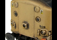A picture of 37509 with heavily faded paintwork showing special effect of where the vinyls have been taken off as per prototype. Other details include bogie modification to reduce gap between body and bogies, moulded roof grill replaced with 3D etched fan and grill, finer aerial added, speedo cable added, rectangular buffers at one end, driver, renumbered, detailed buffer beam at one end with semi detailed at coupling end.