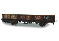 A picture of with added hand painted grafitti and rust with flaking paint.