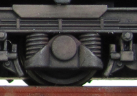 A picture of Close up of class 58 bogies. Note the silver of the metal breaking through on the foot steps.