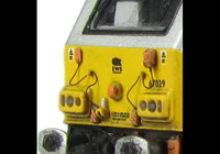 A picture of 67029 with detailed buffer beam at one end and semi detailed at coupler end, moulded jumper cables replaced with wire versions, etched nameplates and driver fitted.