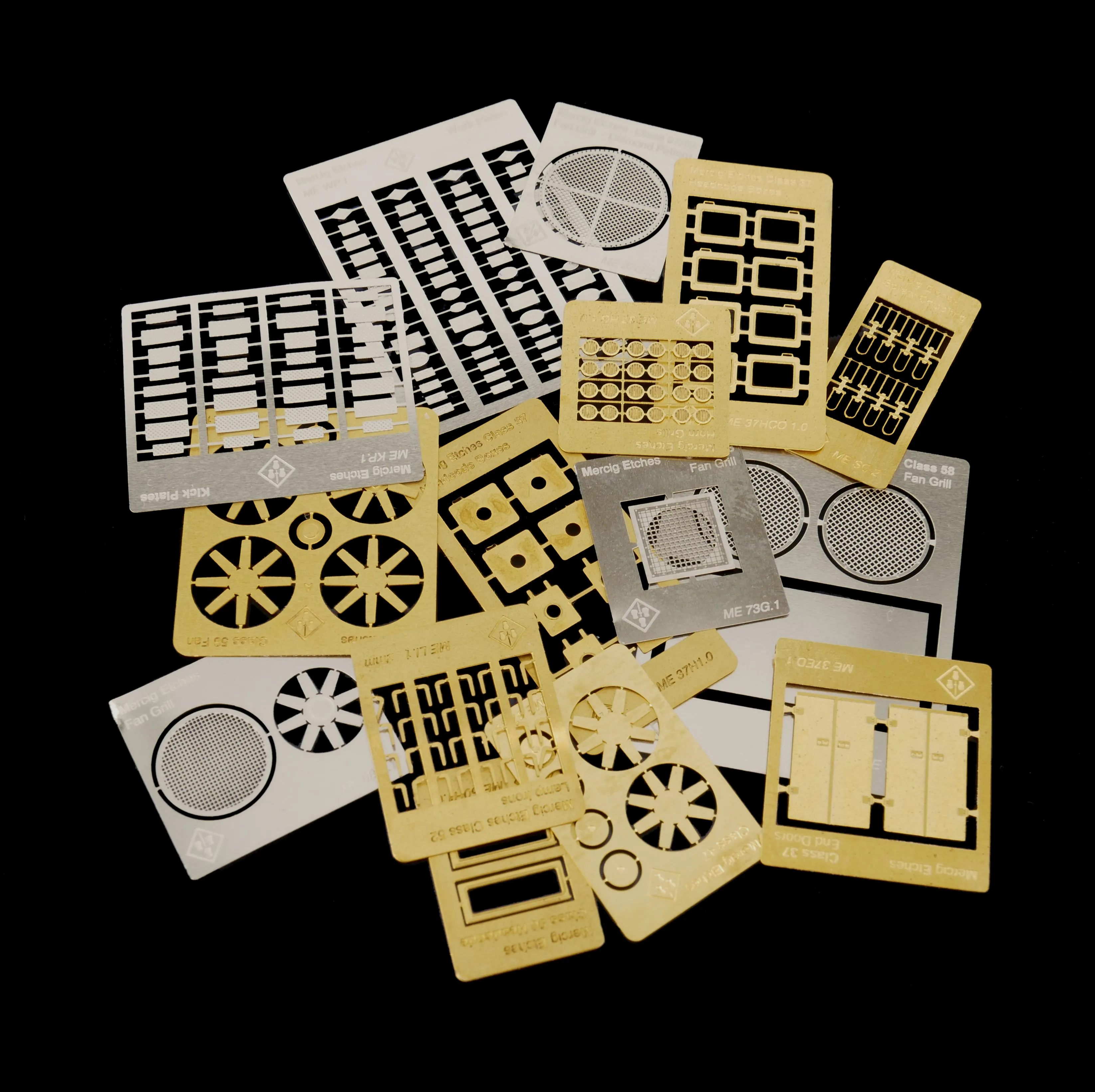 Selection of unique Mercig etched brass parts — fans, grills, nameplates