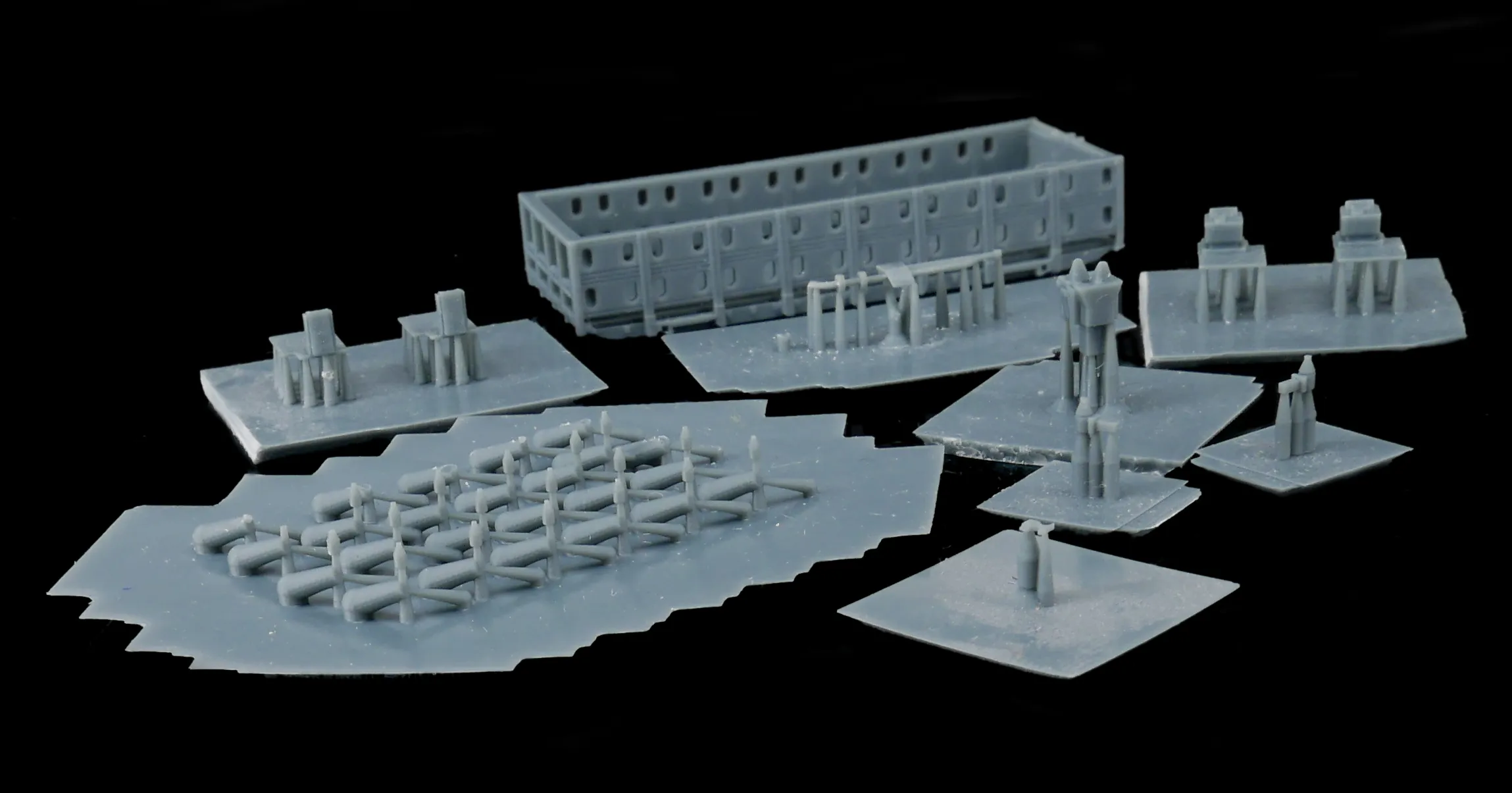 Selection of 3D printed parts — wagon body, buffer beams and detail components