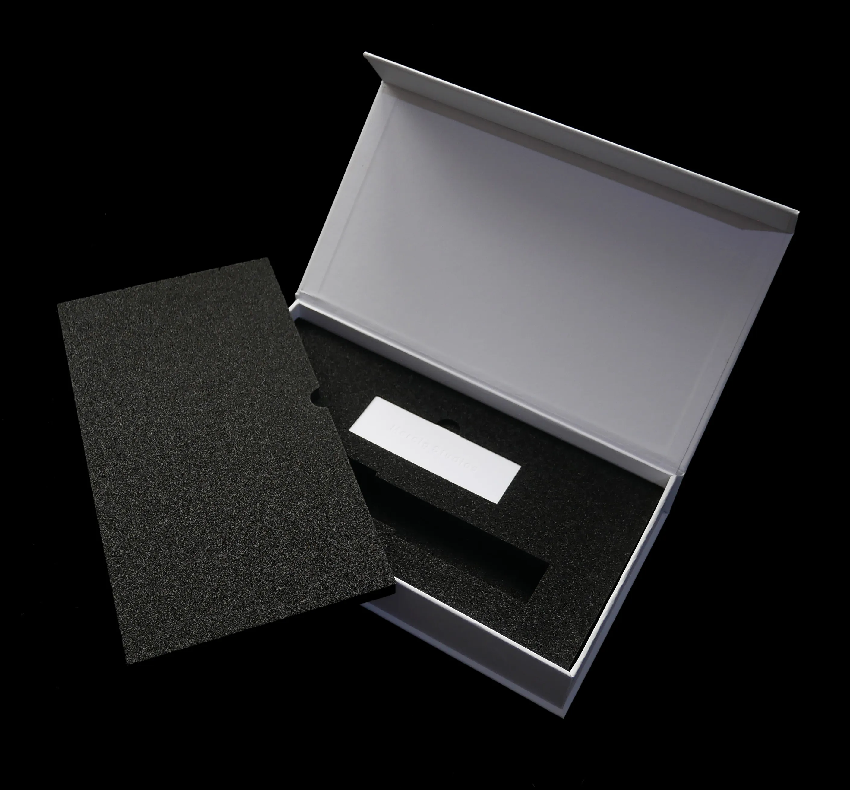 Mercig Studios presentation box — open showing foam insert and certificate