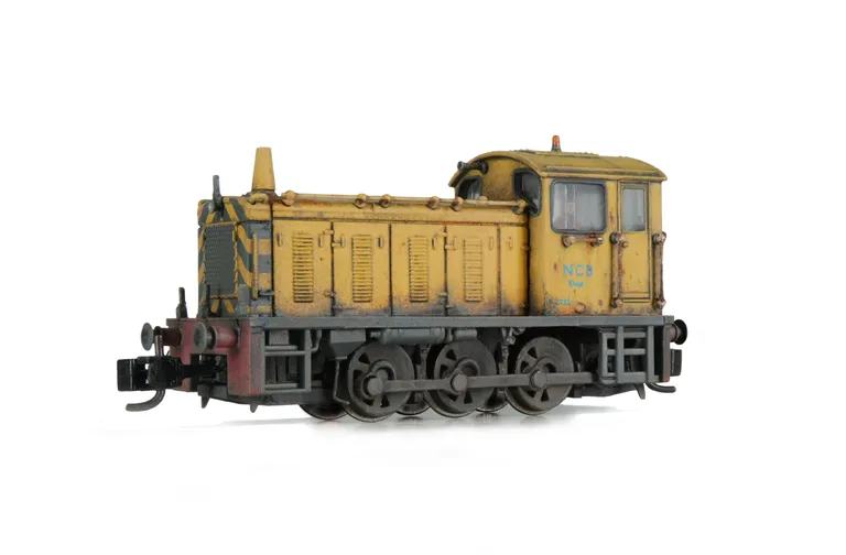 D2332 weathered with special effects of paint flaking, fading and rust. Driver fitted, cab roof and front end lights added.