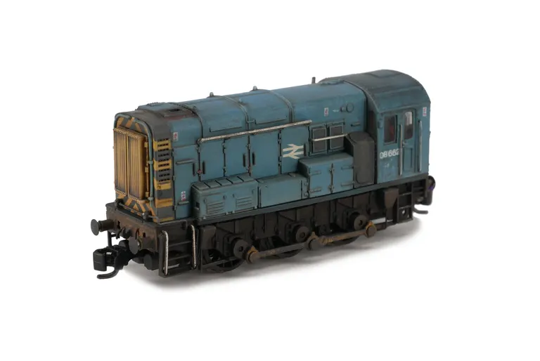 08662 Resprayed to faded BR Blue. Details added: renumbered, door recess added, semi detailed buffer beam at both ends, modified piping at both ends, driver and various livery modifications.