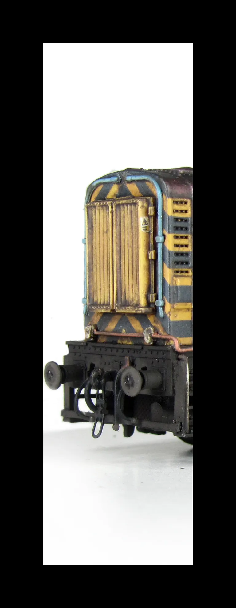 08580 Renumbered with faded paintwork and bleached EWS letters, lamp brackets/piping modifications, detailed buffer beam at one end and semi detailed at coupling end, indented door modification and driver fitted.