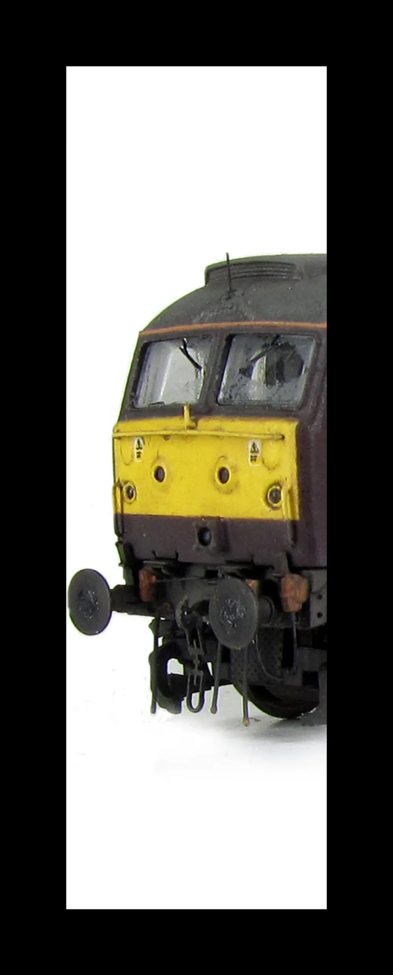 47787 Full respray into West Coast Railways livery and converted to a cutaway buffer beam. Details include battery box modification, foot tread plates below doors, finer ariels, paint peeling on handrails, body lowered, etched fan and grills, renumbered, 