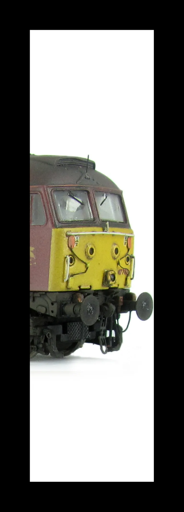 47787 showing a full respray into EWS livery. Base model has been converted to a cutaway buffer beam example with etched kick plates and modified battery box. Other details include: detailed buffer beam at one end and semi detailed at coupling end, driver