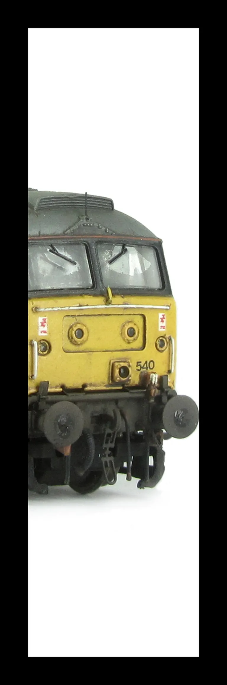 47540 showing a full respray into Dutch livery. Other details include: detailed buffer beam at one end, moulded nose handrails replaced with wire, renumbered, moulded roof grills replaced with etched fan and grill, etched nameplates/plaques, body lowered,