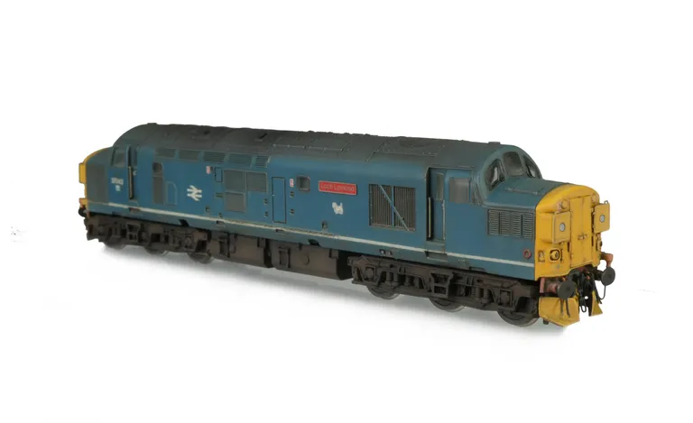 37043 with conversion to a cutaway buffer beam version and semi respray with white stripe. Modifications include; etched headcode covers, renumbered, bogie modification to reduce gap between body and bogies, moulded roof grill replaced with 3D etched fan 