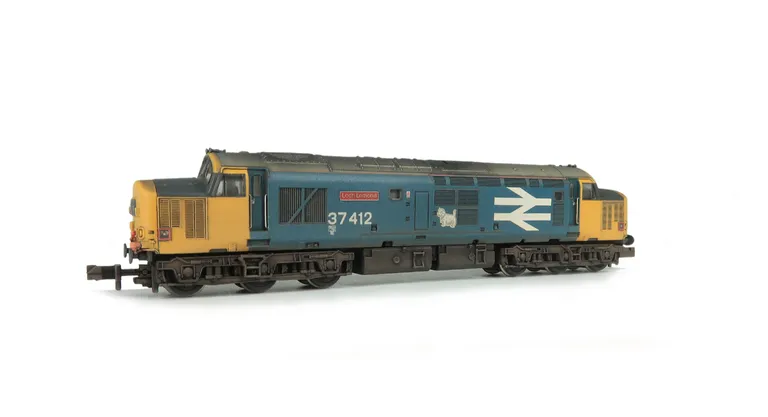 37412 Details include bogie modification to reduce gap between body and bogies, faded paintwork, cantrail added, moulded roof grill replaced with 3D etched fan and grill, etched plates, aerial removed, speedo cable added, renumbered, livery modification w
