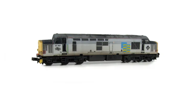 37707 with modification of plated over body windows and steps and semi respray of grey bands to correct shades,  Other details include bogie modification to reduce gap between body and bogies, snowploughs, renumbered and re-livery, semi detailed buffer be