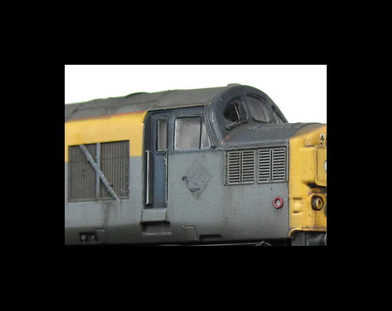 37071 with faded body work and paint chipping. Other added details include: etched headcode surrounds and air horn covers, driver fitted, bogie modification to reduce gap between body and bogies, renumbered, special effect showing the residue left behind 