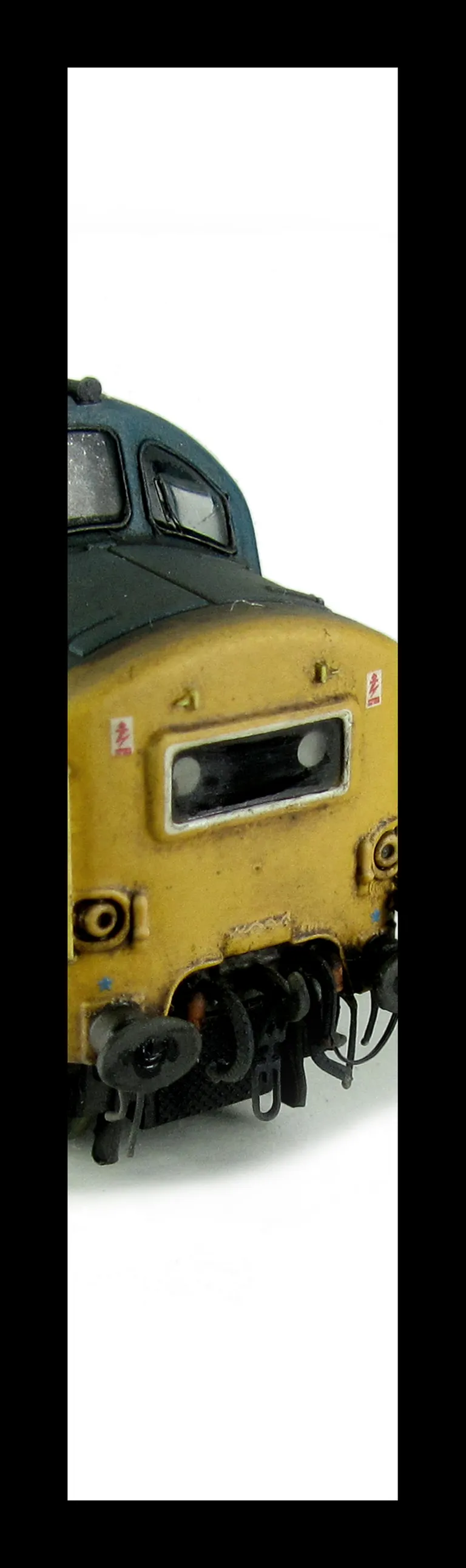 37181 Double detailed buffer beam at one end, renumbered, hand rails/catches added to nose, bogie modification to reduce gap between top of bogies and body, buffers changed, frost grills and driver fitted.