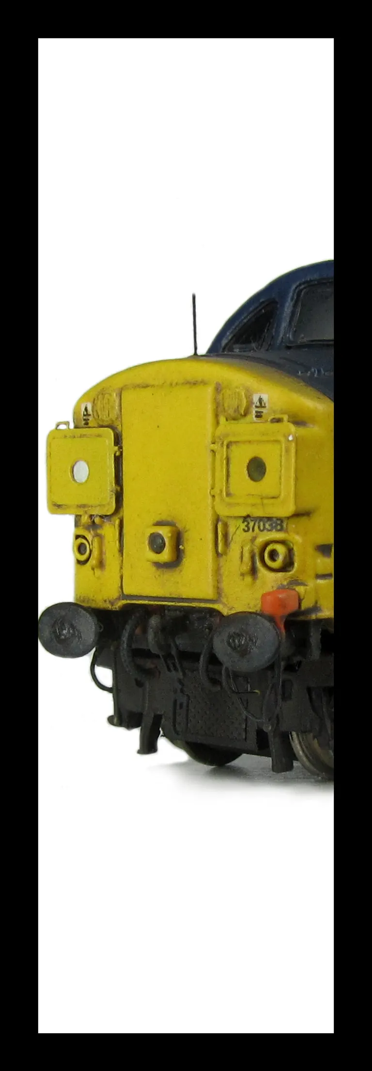 37038 with full respray into DRS livery with boiler ports plated over. Other details include bogie modification to reduce gap between body and bogies, moulded roof grill replaced with 3D etched fan and grill, finer aerial, speedo cable added, etched air h