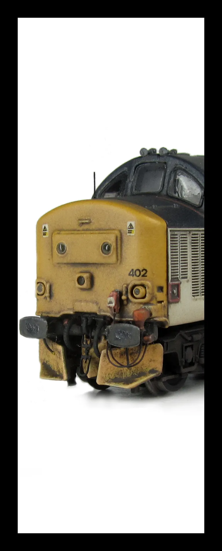 37402 with respray into different shaded RF livery. Other details include bogie modification to reduce gap between body and bogies, bracket on nose, moulded roof grill replaced with 3D etched fan and grill, finer aerial, speedo cable added, rectangular bu