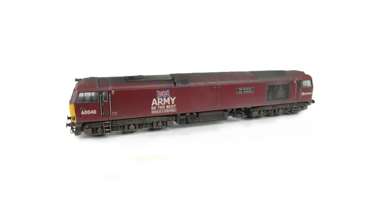 60040 Full respray into Army livery with lowered body, renumbered, detailed buffer beam at one end and driver fitted.