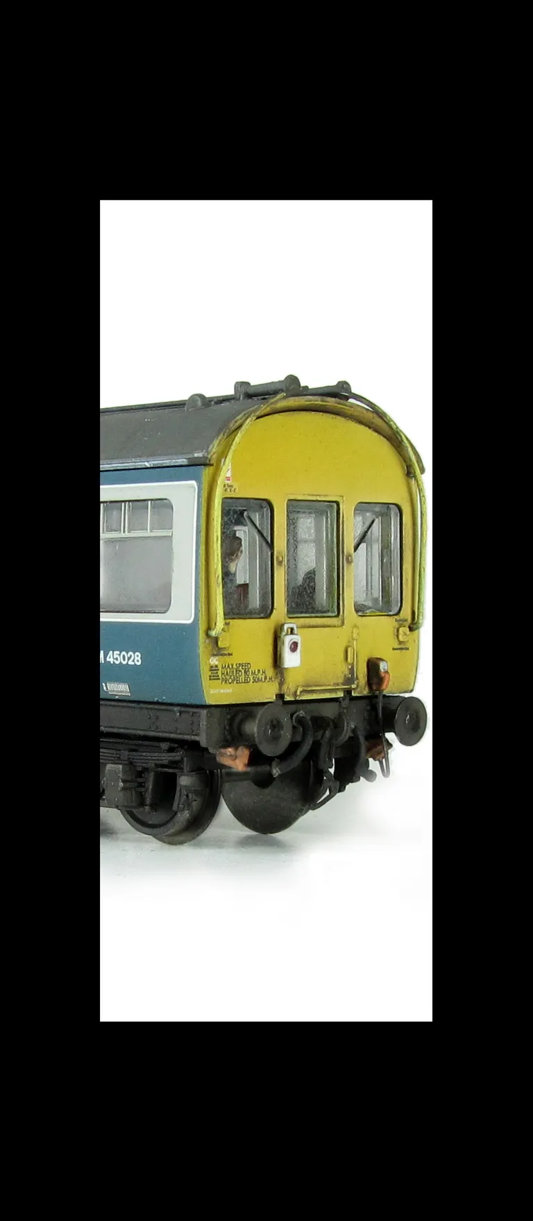 Inspection Saloon with detailed buffer beam at one end, faded paintwork, nose pipes painted and passengers added.