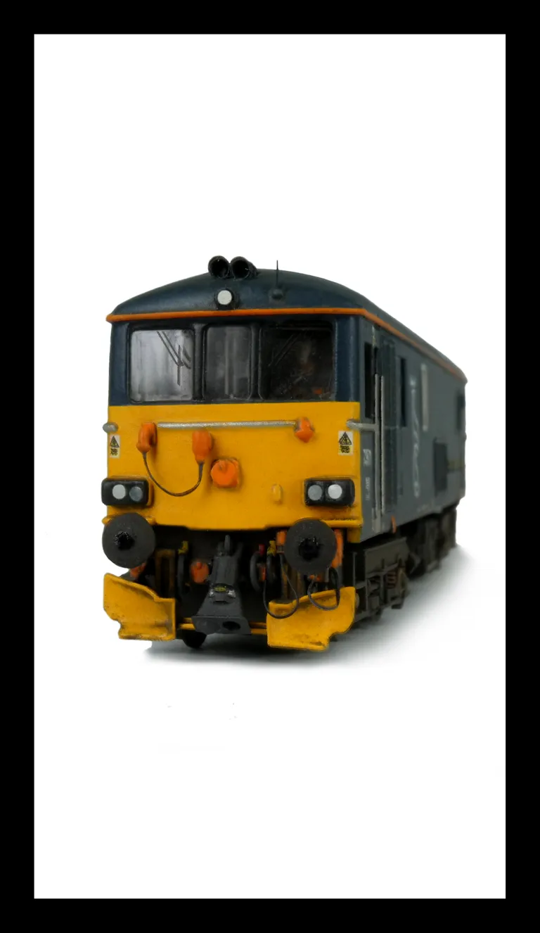 With full respray to Scotrail livery. Modified nose end, snowploughs, detailed buffer beam, renumbered and driver fitted.