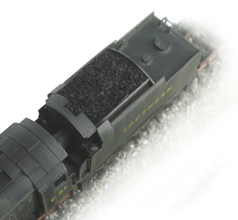 Close up of plastic coal replaced with real coal.