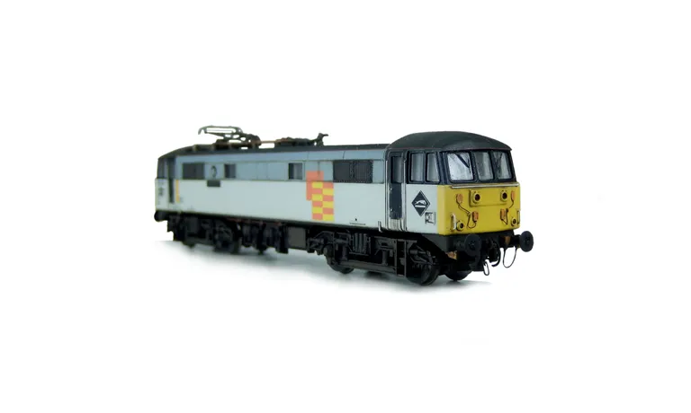 86502 with a semi respray to change the shades of the grey bands and black grills along with a relivery of unbranded on one side and Railfreight general on the other side. Other details include: etched nameplates/plaques, detailed buffer beam at one end w