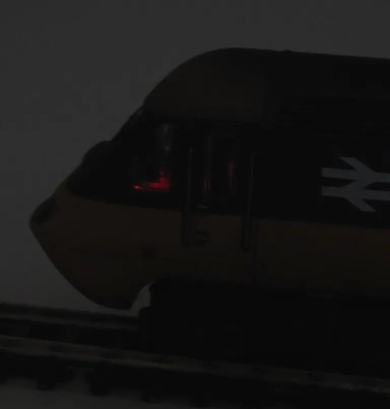 Close up of illuminated dashboard dials.