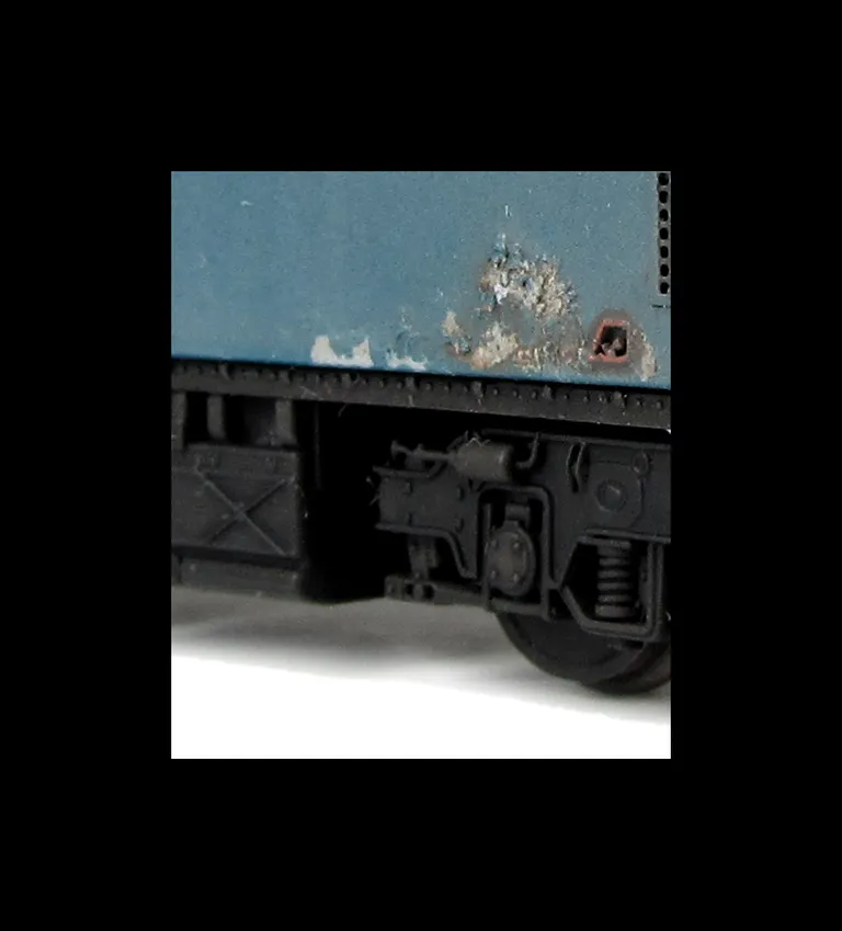 26018 Conversion to disc headcode version representing a loco in it's last days on the scrapline. Full respray into correct faded shades, renumbered, disc catches, special effect of paint peeling and rust patches, broken and boarded over windows, tapered 