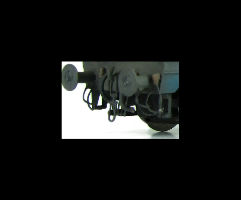 Close up of detailed buffer beam and squared off buffer.