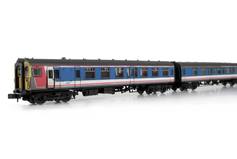 Class 411 with full respray into NSE livery (no transfers used) although remaining in an unrefurbished condition with headlight added.