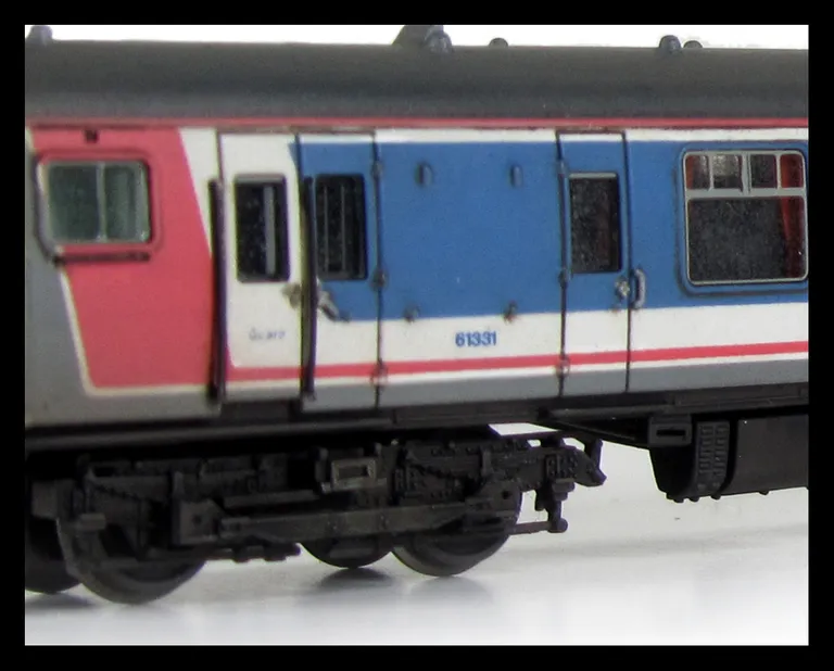 Class 411 with full respray into NSE livery (no transfers used) although remaining in an unrefurbished condition with headlight added.